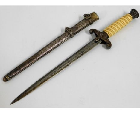 A WW2 German Nazi Third Reich officers dagger with celluloid handle, some loss of silver plate to pommel &amp; top &amp; rear