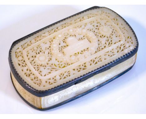 A carved mother of pearl box with fretwork decor &amp; white metal fittings, 4.125in wide x 2.375in deep x 1.25in at highest