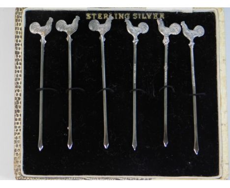 A boxed set of six sterling silver cocktail sticks, 17.7g