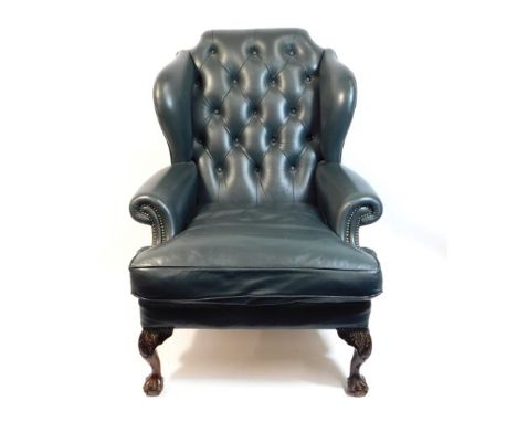 A green leather button back Chesterfield style armchair with ball &amp; claw feet, 45in high to back