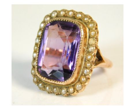 An antique 9ct gold ring set with amethyst &amp; pearl, one pearl lacking, 7g, size L