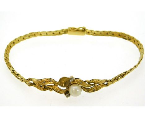 A yellow metal bracelet, electronically tests as 18ct gold, possibly Mappin &amp; Webb, set with diamond &amp; cultured pearl