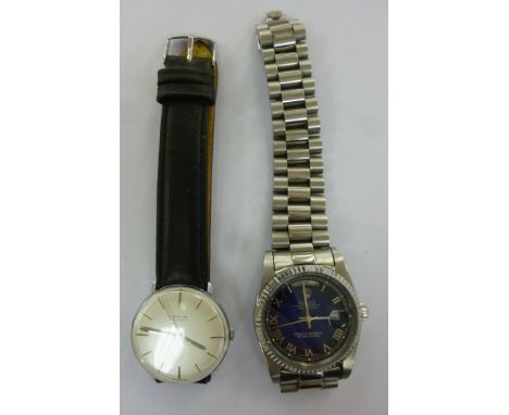 An Avia stainless steel cased wristwatch, the 15 jewel movement faced by a baton dial, on a black hide strap; and other inscr