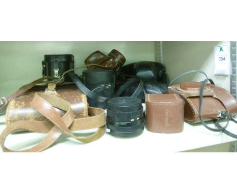 Pre-digital photographic equipment: to include a Zeiss Ikon bellows camera; another in 35mm format; and various lenses       