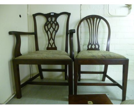 Two late 19thC reproductions of late 18thC style mahogany framed chairs, the first in Chippendale taste, having a ribbon carv
