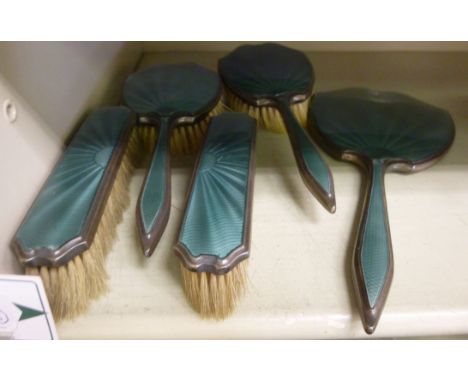 An Asprey & Co five piece, silver backed and engine turned green enamel backed dressing table set  Birmingham 1936       11