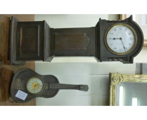 Clocks: to include a 1930s oak cased mantel clock, fashioned as a grandfather clock; the movement faced by an enamel Arabic d