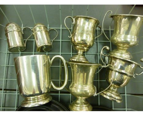 Silver, viz. a pair of tankard design pepper pots; four dissimilar miniature trophy cups  2.5'' - 3''h; a small Christening t