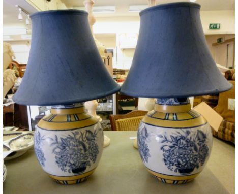 A pair of modern blue and yellow glazed pottery vase of bulbous form  10''h with matching French Navy fabric shades       CA