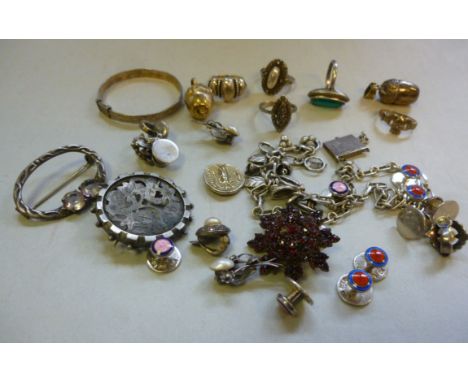 Vintage silver and silver coloured metal jewellery: to include acorn pendants, shirt studs and a foliate cast bracelet       