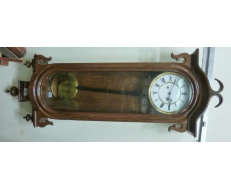 A late 19thC walnut cased Vienna regulator with drop finials; the movement faced by an enamel Roman dial  43''h         HSR