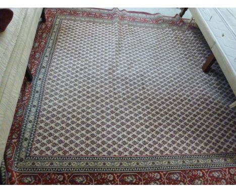 A Persian design machine made carpet with repeated hook motifs  99'' x 122''       BSR