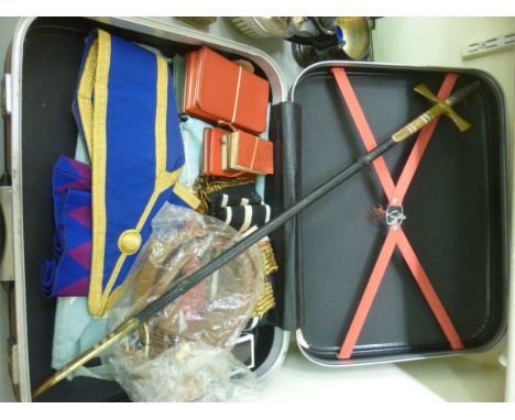 Masonic regalia, comprising badges, books, belts, garments and a sword, the blade 29''L with a scabbard       S