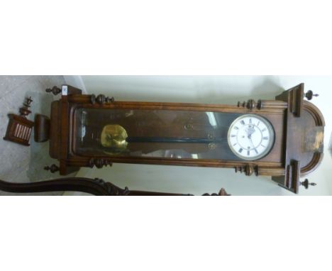 A late 19thC mahogany cased regulator, having an arched top, a glazed door, flanked by fluted columns and turned finials; the