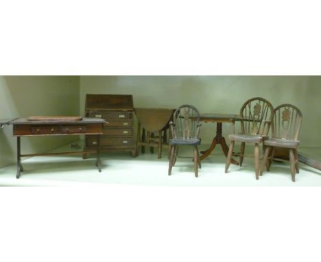 20thC dolls house furniture: to include three stained beech, hoop and stick back Windsor chairs       OS6
