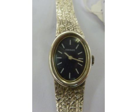 A lady's Tissot cased bracelet watch, faced by a baton dial  stamped 925       11