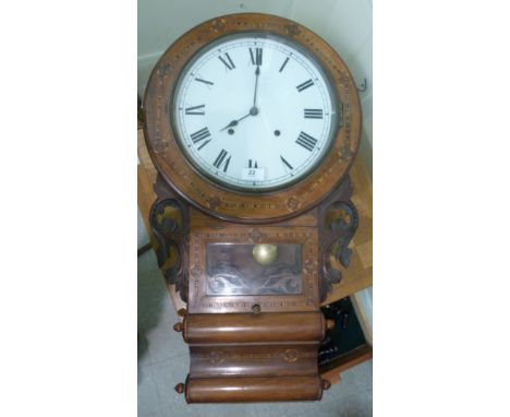 A late 19thC marquetry mahogany and cased wall drop dial clock, having a glazed window, flanked by carved ornament; faced by 