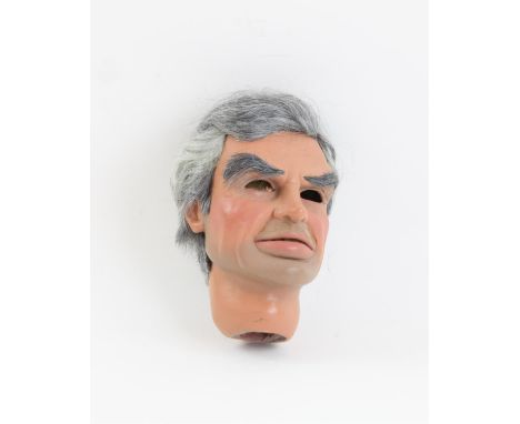 Grey haired puppet head with moveable lower lip made by Phil Eason, 13 cm. Provenance: The Phil Eason Collection. No copyrigh