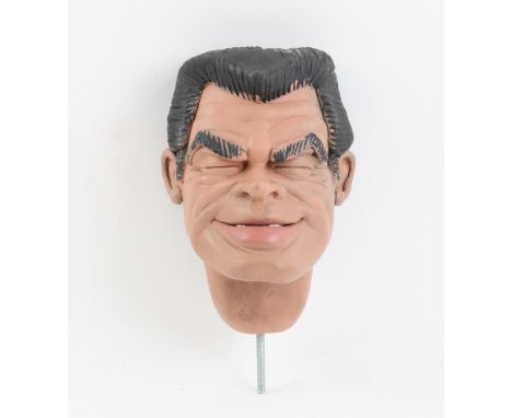 Black haired puppet head with moveable lower lip made by Phil Eason, 15 cm. Provenance: The Phil Eason Collection. No copyrig