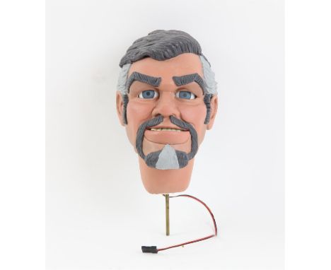 Brown haired puppet head with goatee with motorised moveable lower lip and eyes made by Phil Eason, 15 cm. Provenance: The Ph