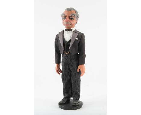 Parker puppet on wooden stand, hand constructed by Phil Eason, approx. 52 cm. Aloysius "Nosey" Parker is a fictional characte