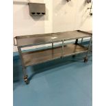 STAINLESS STEEL TABLE ON WHEELS