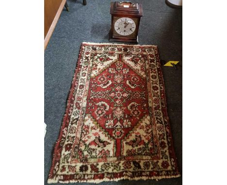 MAHOGANY CASES CHIMING PENDULUM CLOCK &amp; SMALL RED CROWNED PATTERN RUG 33'' X 22''
