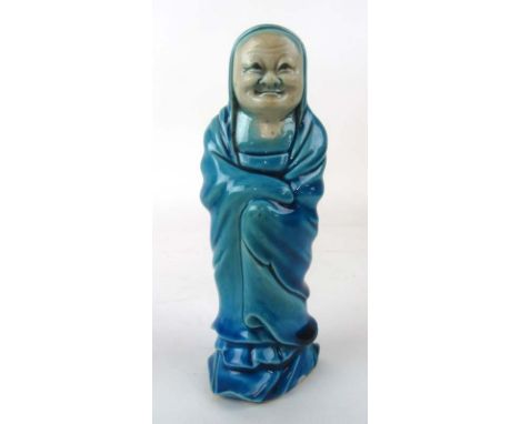 A Chinese blue-glazed ceramic figure of an elderly woman. H 15 cm CONDITION REPORT: No obvious damage 