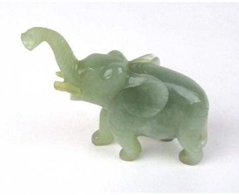 A Chinese carved jadeite figure of an elephant. H. 8 cm CONDITION REPORT: Slight damage to the end of trunk and tusks
