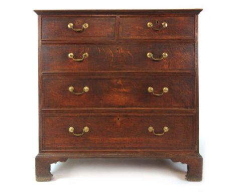 A late 18th century oak and mahogany banded chest of two short over three long drawers on bracket feet, h. 103 cm, w. 104 cm,