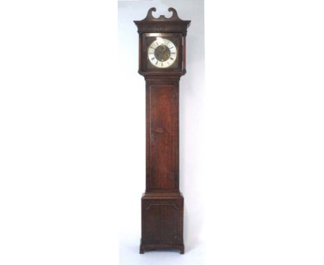 An 18th century oak longcase clock, the swan neck pediment over a brass and silvered face with Roman and Arabic numerals, sec