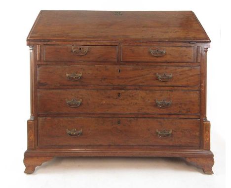 A George III mahogany and marquetry bureau, the fall front revealing a satinwood veneered fitted interior over two short and 
