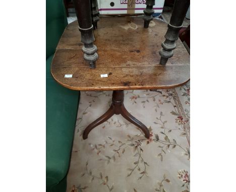 A GEORGE III PERIOD OAK FLIP-TOP CENTRE TABLE, on turned stem and tripod base, 23” (58cm). (1)