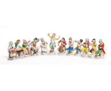 A VERY ATTRACTIVE TWELVE PIECE DRESDEN PORCELAIN MONKEY BAND OR ORCHESTRA, each figure playing a different instrument, includ