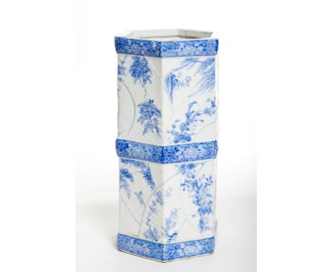 A JAPANESE HEXAGONAL BLUE AND WHITE PORCELAIN STICK AND UMBRELLA STAND, with floral decoration, 23.5" (60cm) high,11" (28cm) 