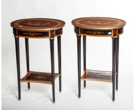 A PAIR OF ATTRACTIVE OVAL EBONISED AND SATINWOOD MARQUETRY LAMP OR SIDE TABLES, each top with a brass edge, inlaid with cheru