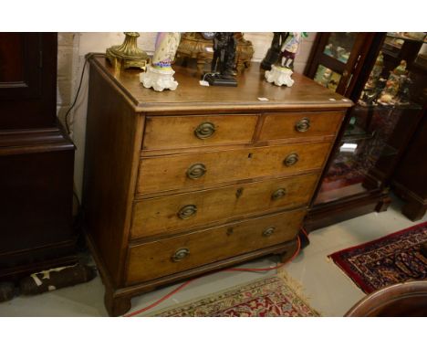 A GEORGE III PERIOD MAHOGANY CHEST, with three long and two short drawers, raised on bracket feet, 39” (99cm). (1) 