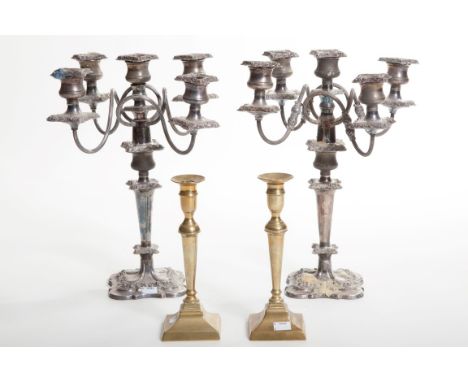 A PAIR OF VERY HEAVY FOUR-BRANCH FIVE-LIGHT SILVER-PLATE CANDELABRA, each with scrolling reeded arms, with leaf cast collars,