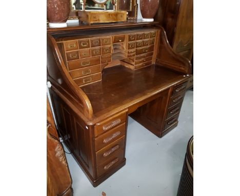 A GOOD QUALITY WALNUT PEDESTAL DESK, with oblong moulded top, above an arrangement of drawers, and pigeon hole compartments, 