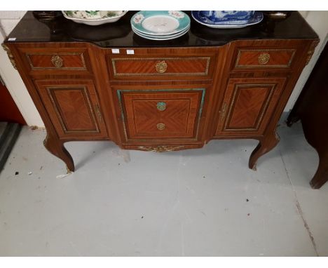 A TRANSITIONAL STYLE FRENCH KINGWOOD COMMODE, of breakfront outline, with three frieze drawers and two cupboards below and tw