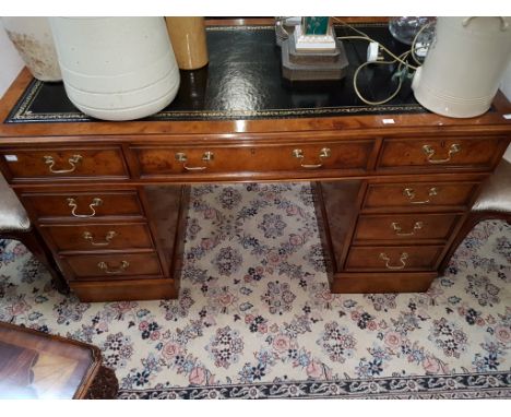 A VERY GOOD GEORGE III STYLE BURL WALNUT PEDESTAL DESK, O.R.M., with attractive tooled leather top above three frieze drawers