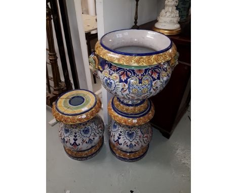 A FINE 19TH CENTURY FAIENCE JARDINIERE AND PEDESTAL, the monochrome decorated jardiniere body, with colourful flowers and arm