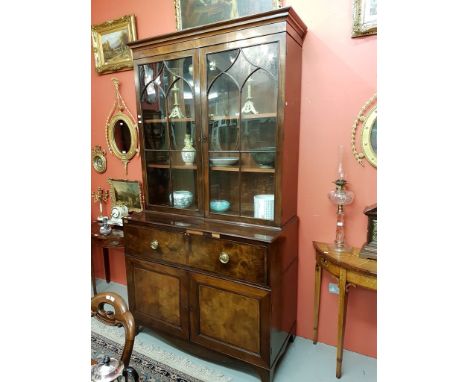 A GEORGE III PERIOD INLAID AND CROSS-BANDED SECRETAIRE BOOKCASE, the moulded cornice above two Gothic glazed doors, the friez