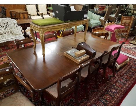 A VICTORIAN MAHOGANY TWIN PEDESTAL DINING TABLE, probably Irish, the moulded top with a spare centre leaf, raised on two quad