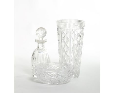 A WATERFORD CRYSTAL CUT CRYSTAL DECANTER, with bulbous stopper, 12.5" (27cm); together with a tall crystal vase of tapering c