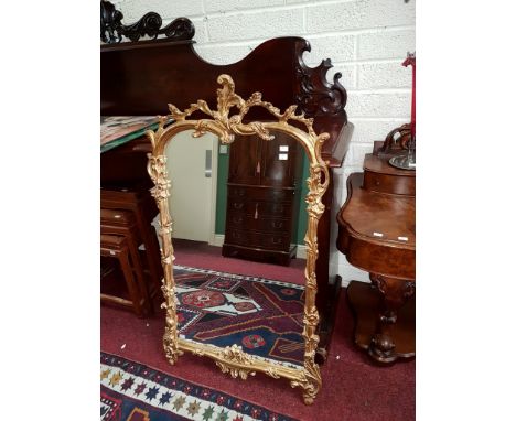 A FINE CHIPPENDALE STYLE GILT PIER MIRROR, O.R.M., the frame moulded with scrolling foliage, and cluster columns to the side 