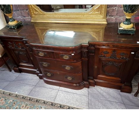 A LARGE CHIPPENDALE STYLE CARVED MAHOGANY BREAKFRONT SIDE CHEST OR SERVING TABLE, the guilloche-moulded frieze and centre sec