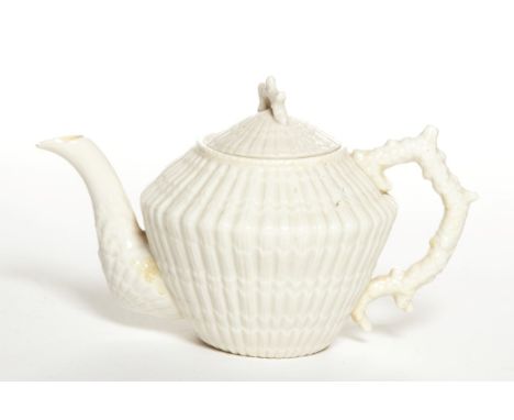 A BELLEEK TEAPOT, with coral handle and cover, third period 1926-1946, 11" (28cm) high. (1) 