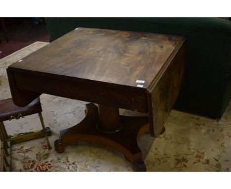 A WILLIAM IV PERIOD MAHOGANY PEMBROKE OR SOFA TABLE, probably Irish, the top with two D-shaped flaps, flanking two frieze dra