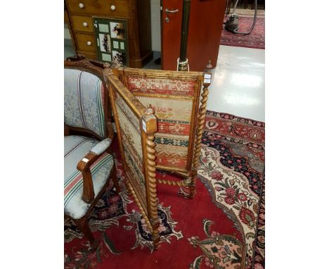 A VICTORIAN TWO FOLD SATIN BIRCH SCREEN, with pull-up tapestry panels and urn finials, each flanked with spiral-reeded pilast